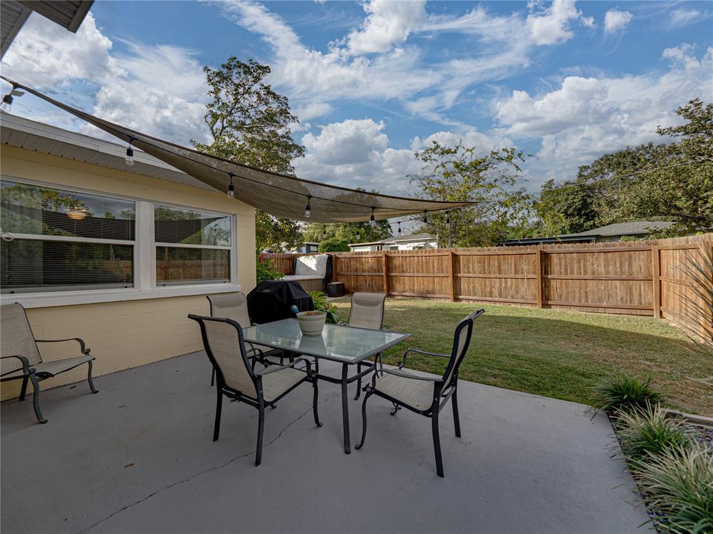 228 Azalea Street Lakeland, FL 33803 - Photo 50 of 80 a view of a house with backyard and sitting area