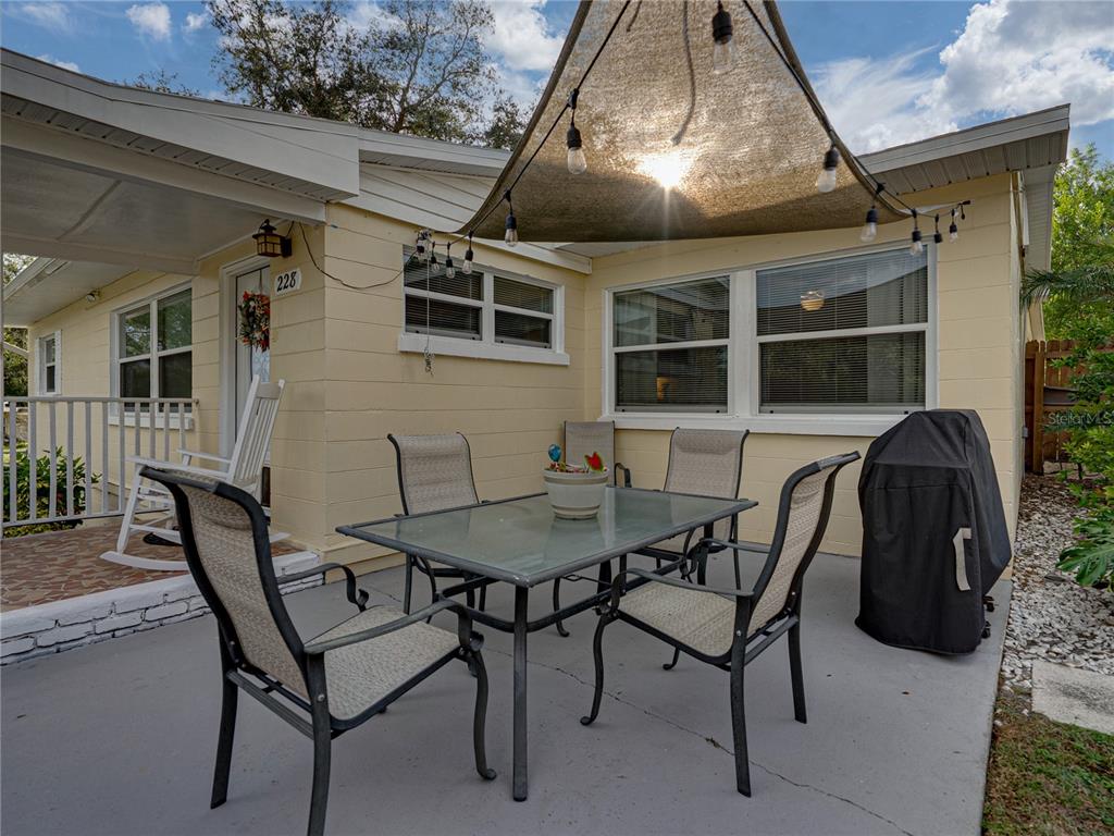 228 Azalea Street Lakeland, FL 33803 - Photo 51 of 80 a patio with table and chairs