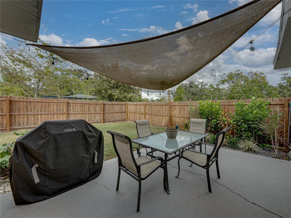 228 Azalea Street Lakeland, FL 33803 - Photo 52 of 80 a view of a chairs and table in the patio