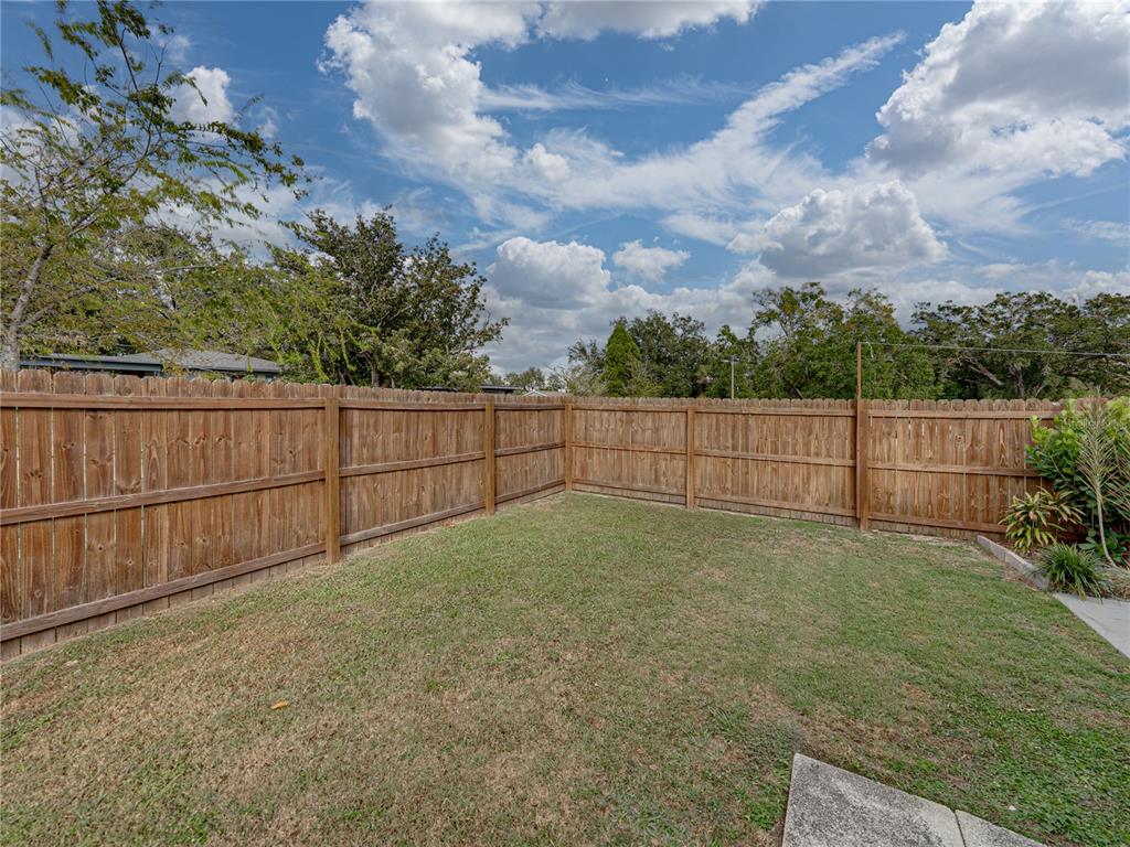 228 Azalea Street Lakeland, FL 33803 - Photo 56 of 80 a view of backyard with wooden fence