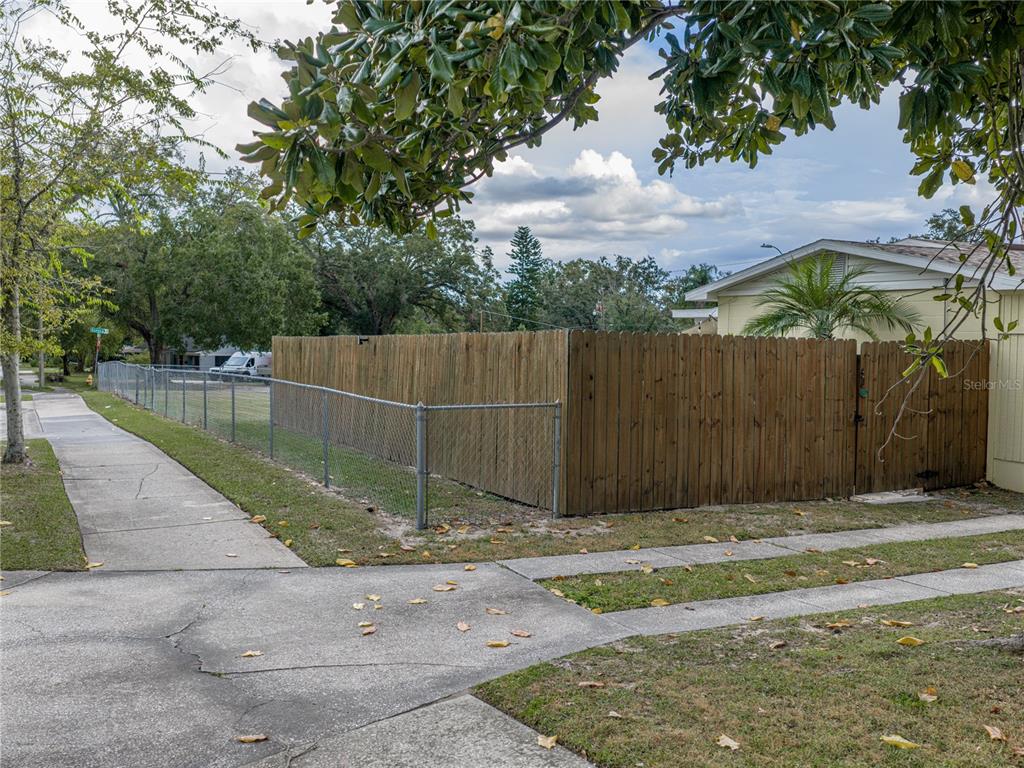 228 Azalea Street Lakeland, FL 33803 - Photo 59 of 80 a backyard of a house with lots of green space