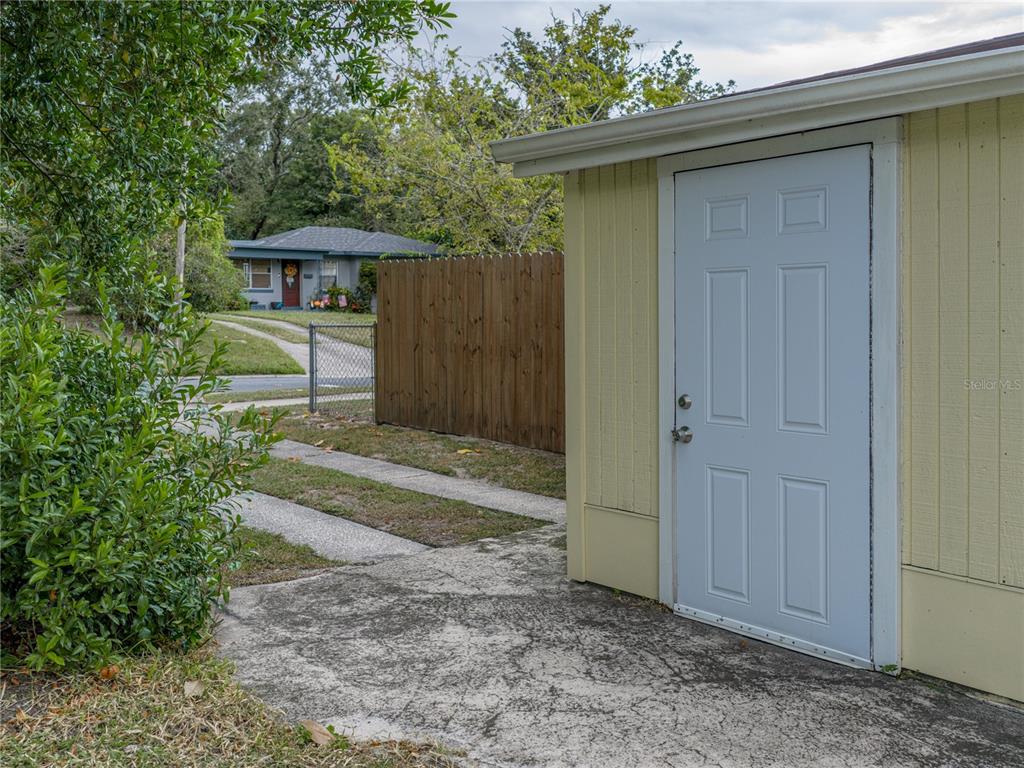 228 Azalea Street Lakeland, FL 33803 - Photo 61 of 80 a front view of a house with a yard
