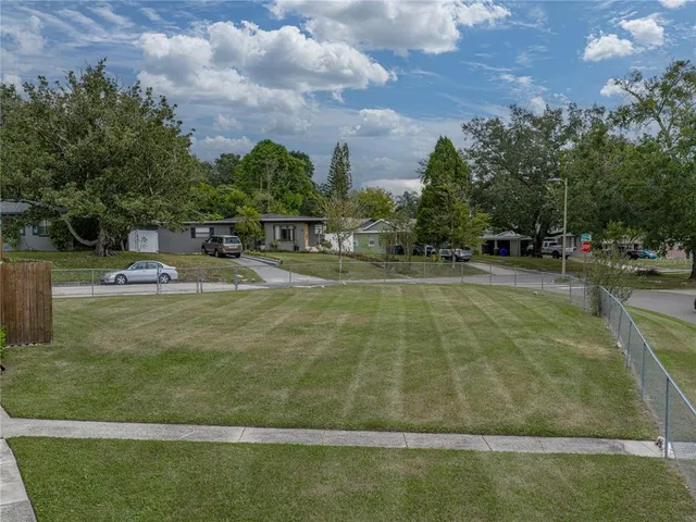 a view of hallway with window and furniture