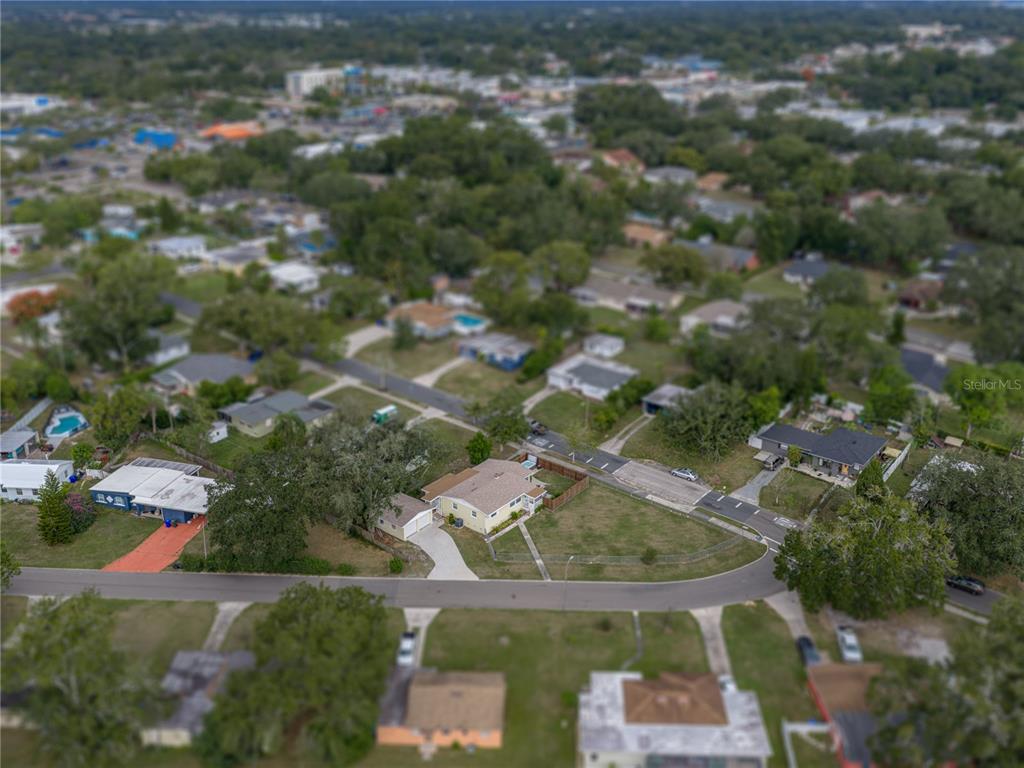 228 Azalea Street Lakeland, FL 33803 - Photo 71 of 80 an aerial view of residential houses with outdoor space and trees