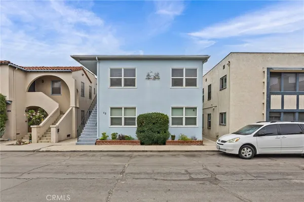 a view of a car parked in front of a house