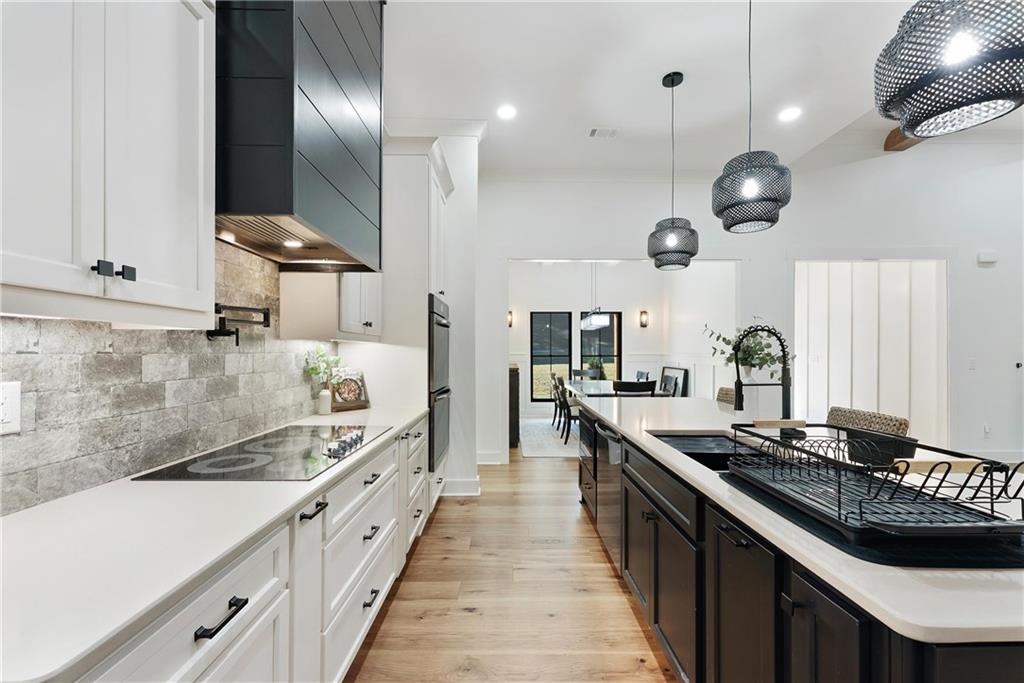 100 Ridge Way Forsyth, GA 31029 - Photo 16 of 99 a large kitchen with a large stove and cabinets