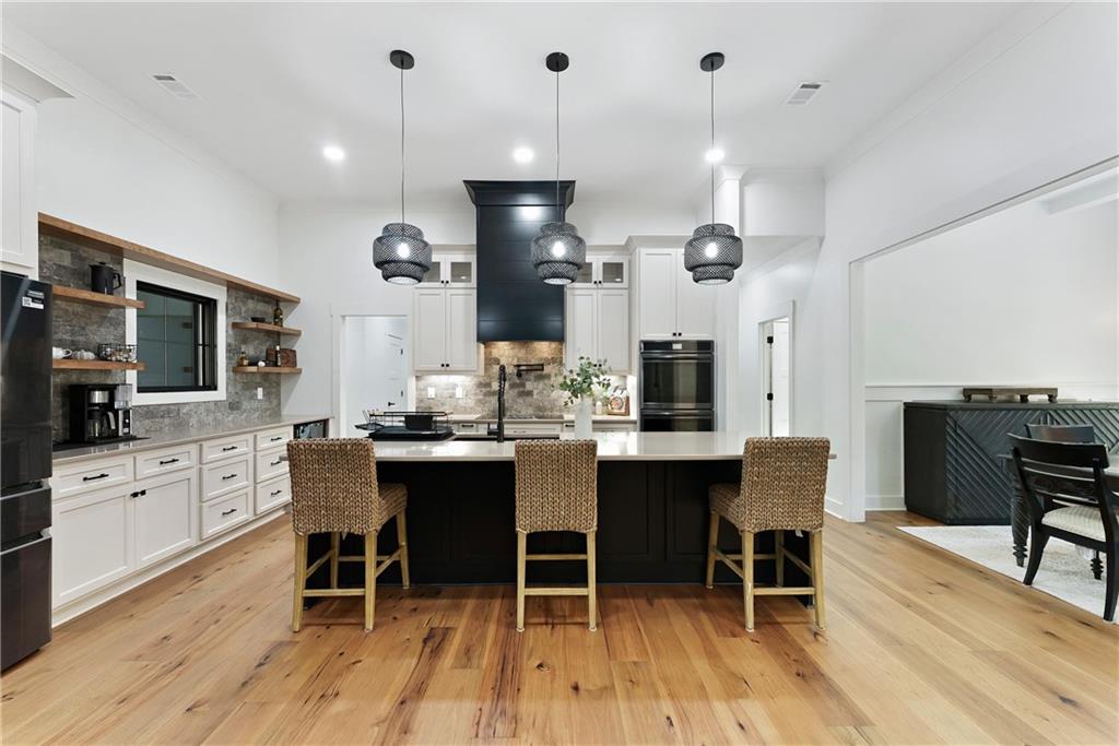 100 Ridge Way Forsyth, GA 31029 - Photo 18 of 99 a large kitchen with a table and chairs