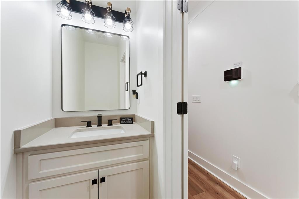 100 Ridge Way Forsyth, GA 31029 - Photo 27 of 99 a bathroom with a sink and a mirror