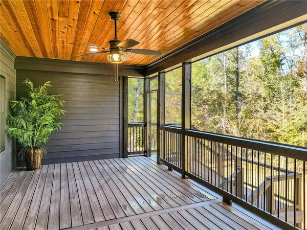 a view of a backyard with sitting area