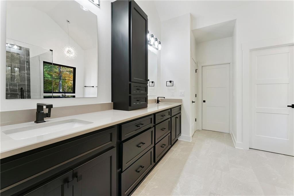 100 Ridge Way Forsyth, GA 31029 - Photo 34 of 99 a spacious bathroom with double sink and a mirror