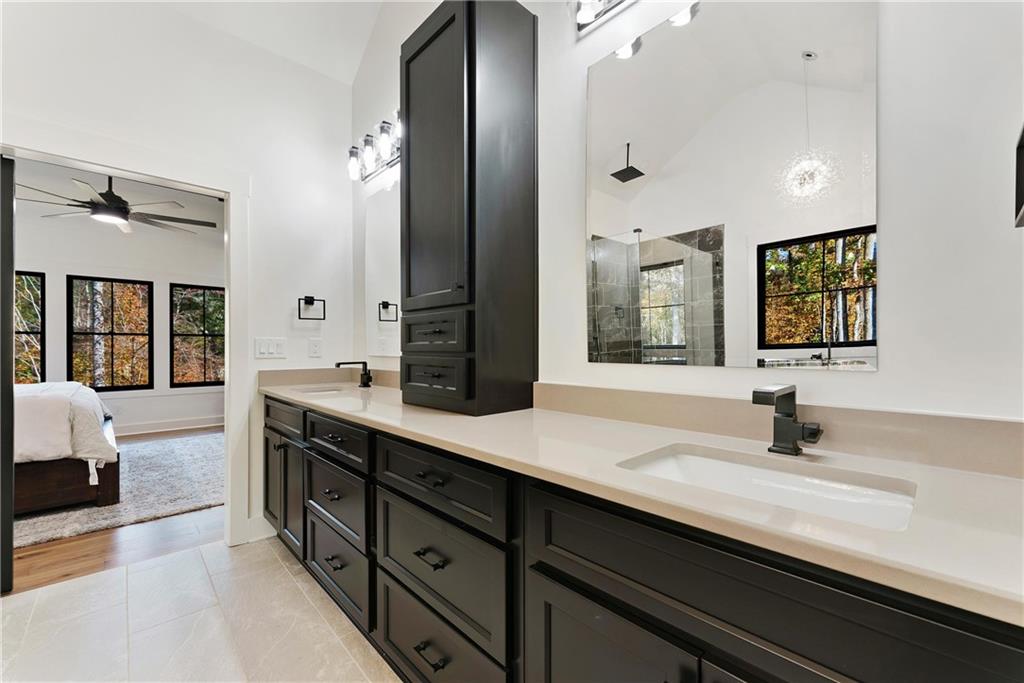 100 Ridge Way Forsyth, GA 31029 - Photo 36 of 99 a bathroom with a sink double vanity granite tub and a mirror