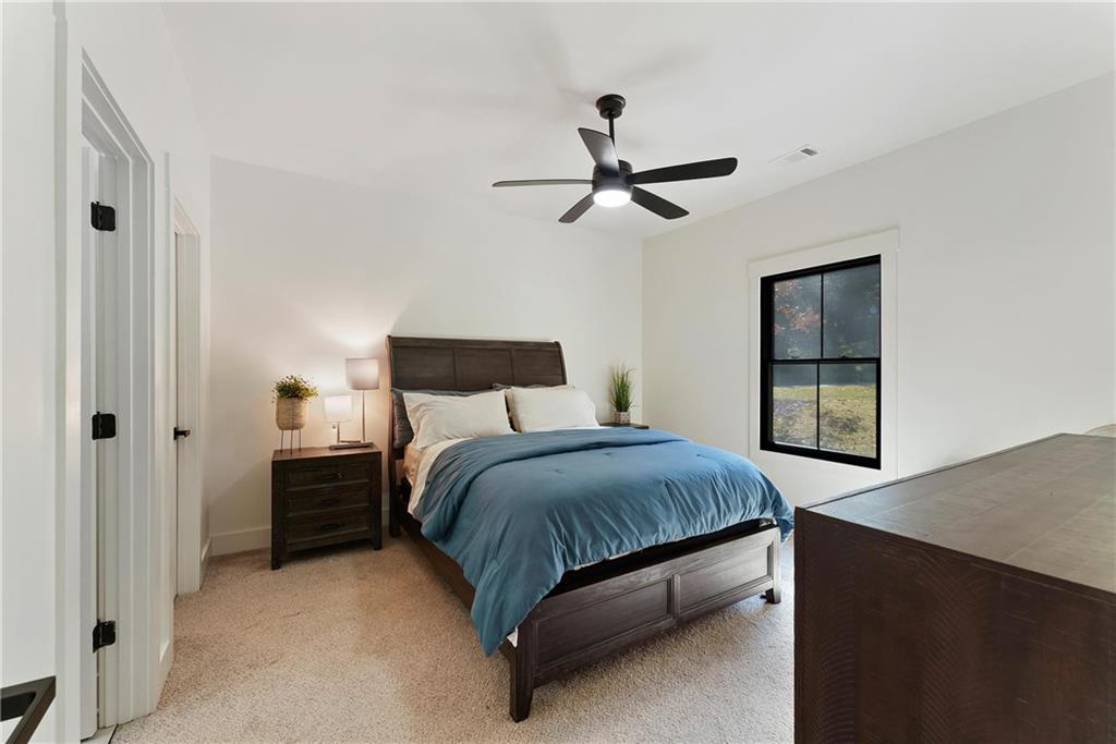 100 Ridge Way Forsyth, GA 31029 - Photo 42 of 99 a bedroom with a bed and a window