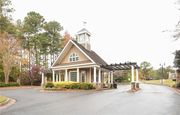 a view of a hallway with staircase with white walls