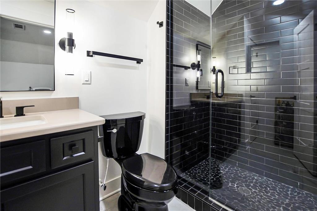 100 Ridge Way Forsyth, GA 31029 - Photo 47 of 99 a bathroom with a sink and a mirror