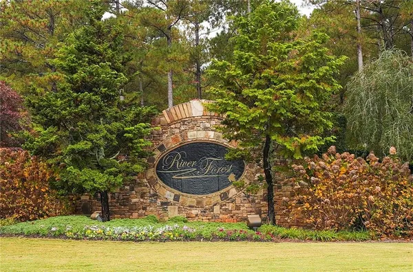 a front view of a house with a yard table and chairs