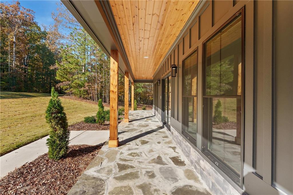 100 Ridge Way Forsyth, GA 31029 - Photo 5 of 99 a view of a pathway of a house with a backyard