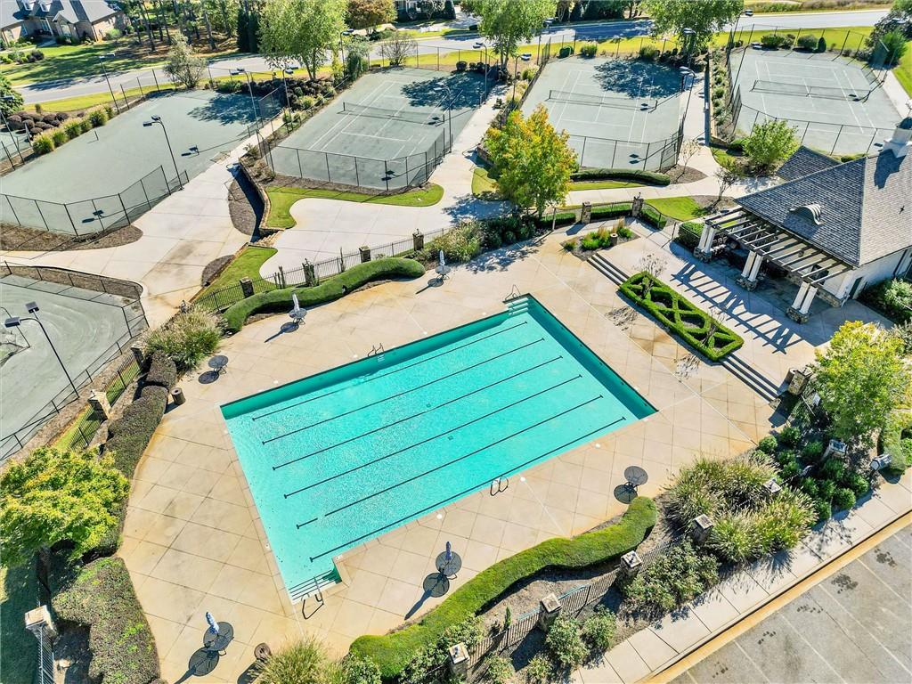 100 Ridge Way Forsyth, GA 31029 - Photo 77 of 99 an aerial view of a house with a garden and swimming pool