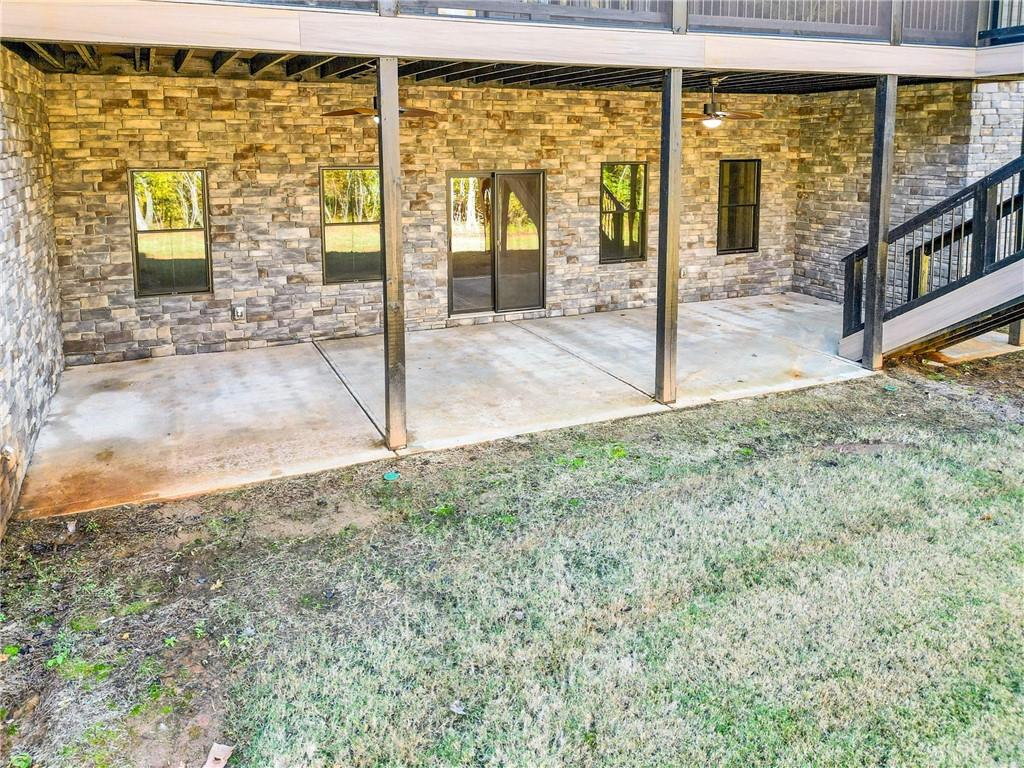 100 Ridge Way Forsyth, GA 31029 - Photo 86 of 99 a view of a glass door with a yard