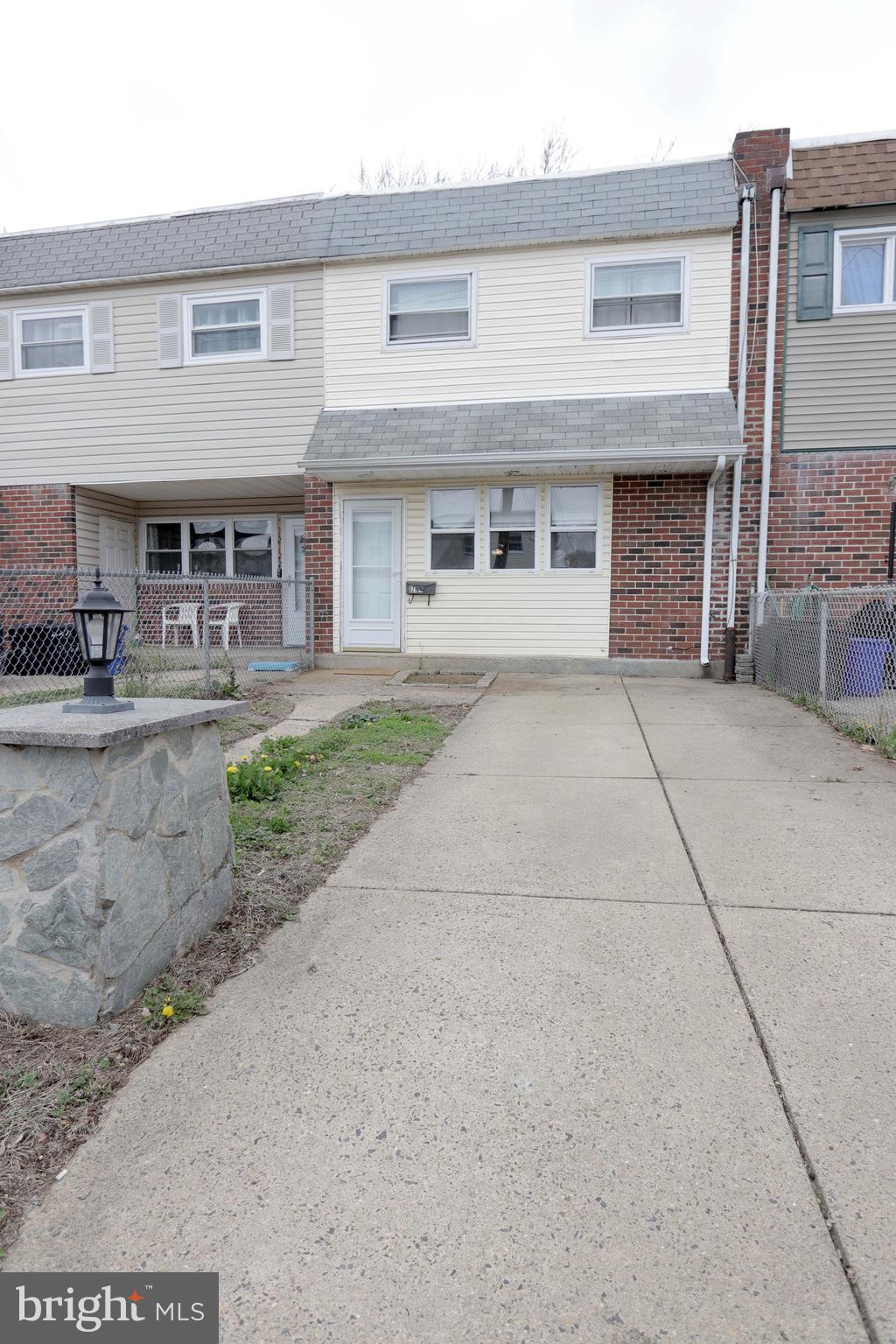 12124 Rambler Road Philadelphia, PA 19154 - Photo 1 of 26 a front view of a house with yard and furniture