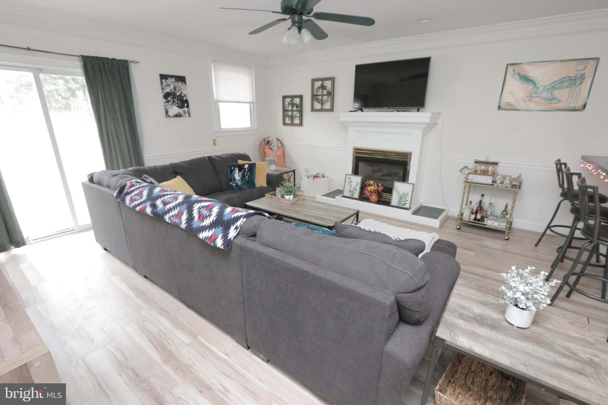 12124 Rambler Road Philadelphia, PA 19154 - Photo 13 of 26 a living room with furniture fireplace and a flat screen tv