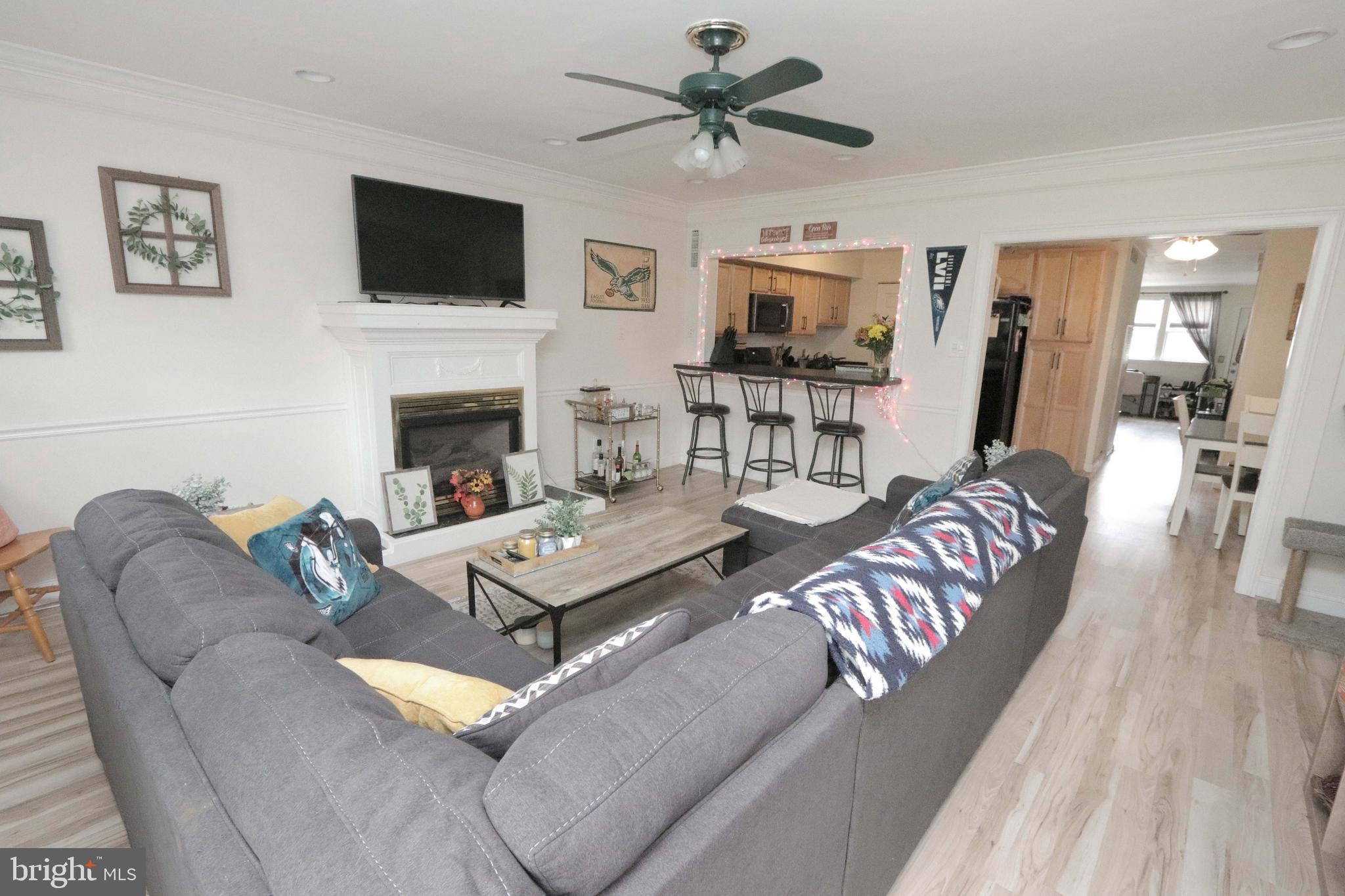 12124 Rambler Road Philadelphia, PA 19154 - Photo 14 of 26 a living room with furniture a flat screen tv and a fireplace