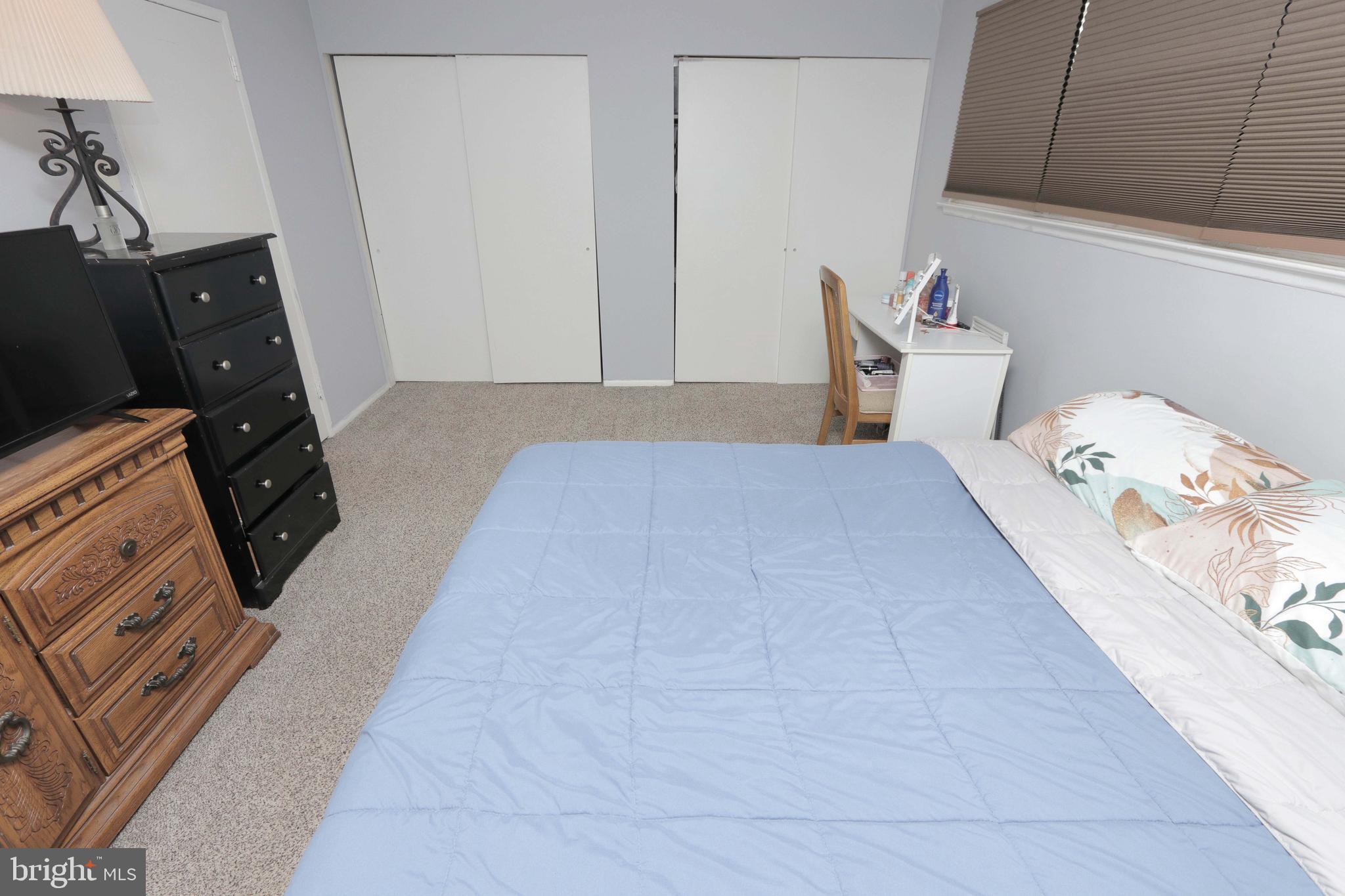 12124 Rambler Road Philadelphia, PA 19154 - Photo 17 of 26 a bedroom with a bed and wooden floor