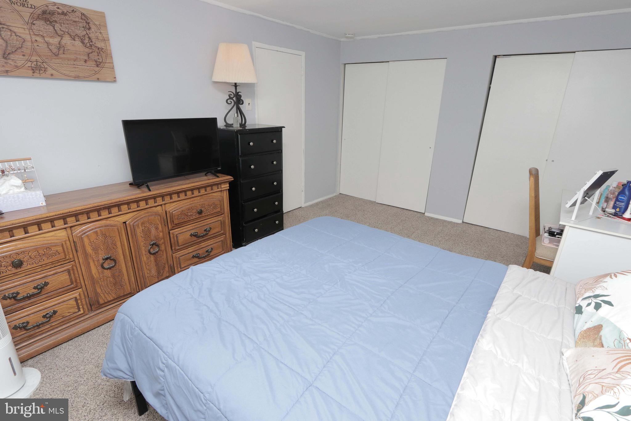12124 Rambler Road Philadelphia, PA 19154 - Photo 18 of 26 a bedroom with a bed and a flat tv screen on dresser
