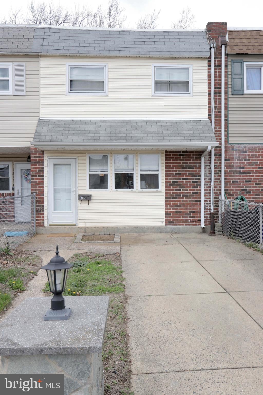 12124 Rambler Road Philadelphia, PA 19154 - Photo 2 of 26 a front view of a house with garden