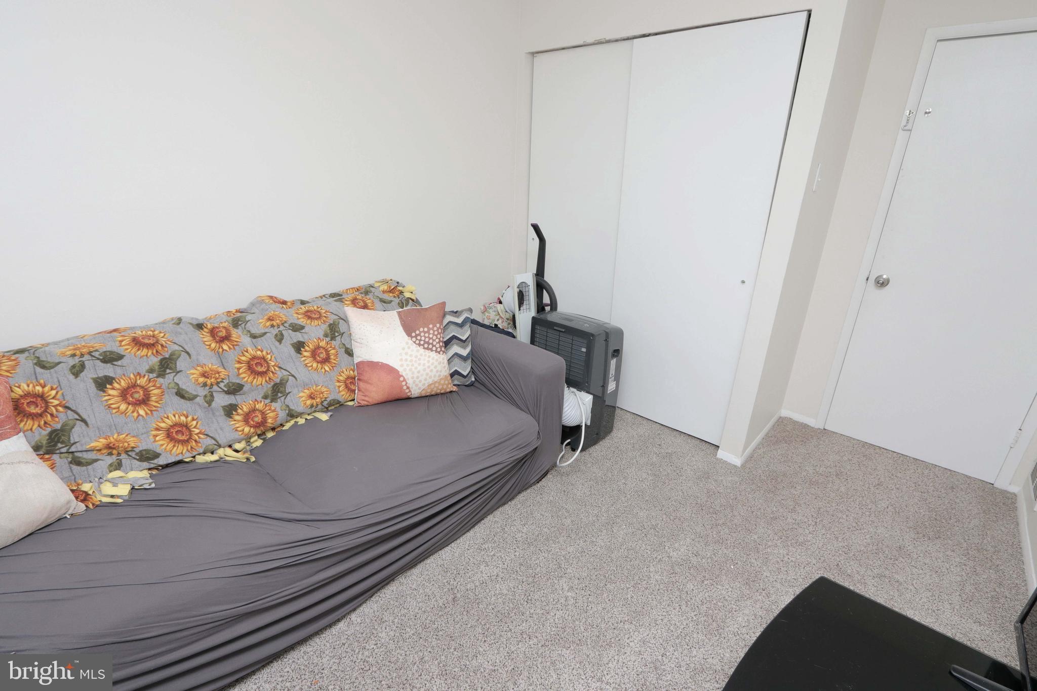 12124 Rambler Road Philadelphia, PA 19154 - Photo 23 of 26 a bedroom with a bed and a window