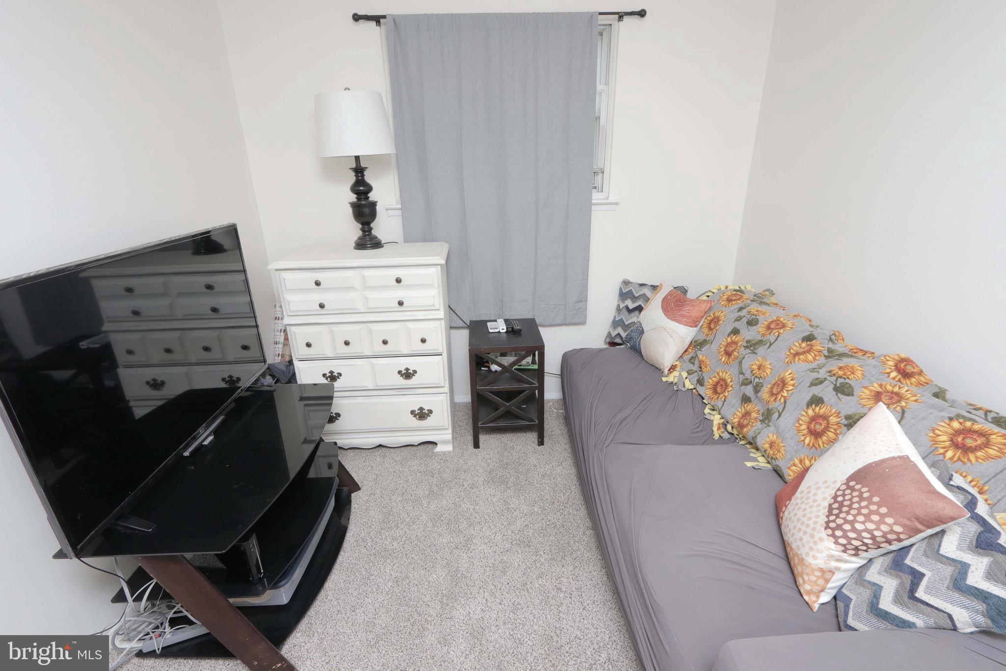 12124 Rambler Road Philadelphia, PA 19154 - Photo 24 of 26 a bed room with a bed and a chair