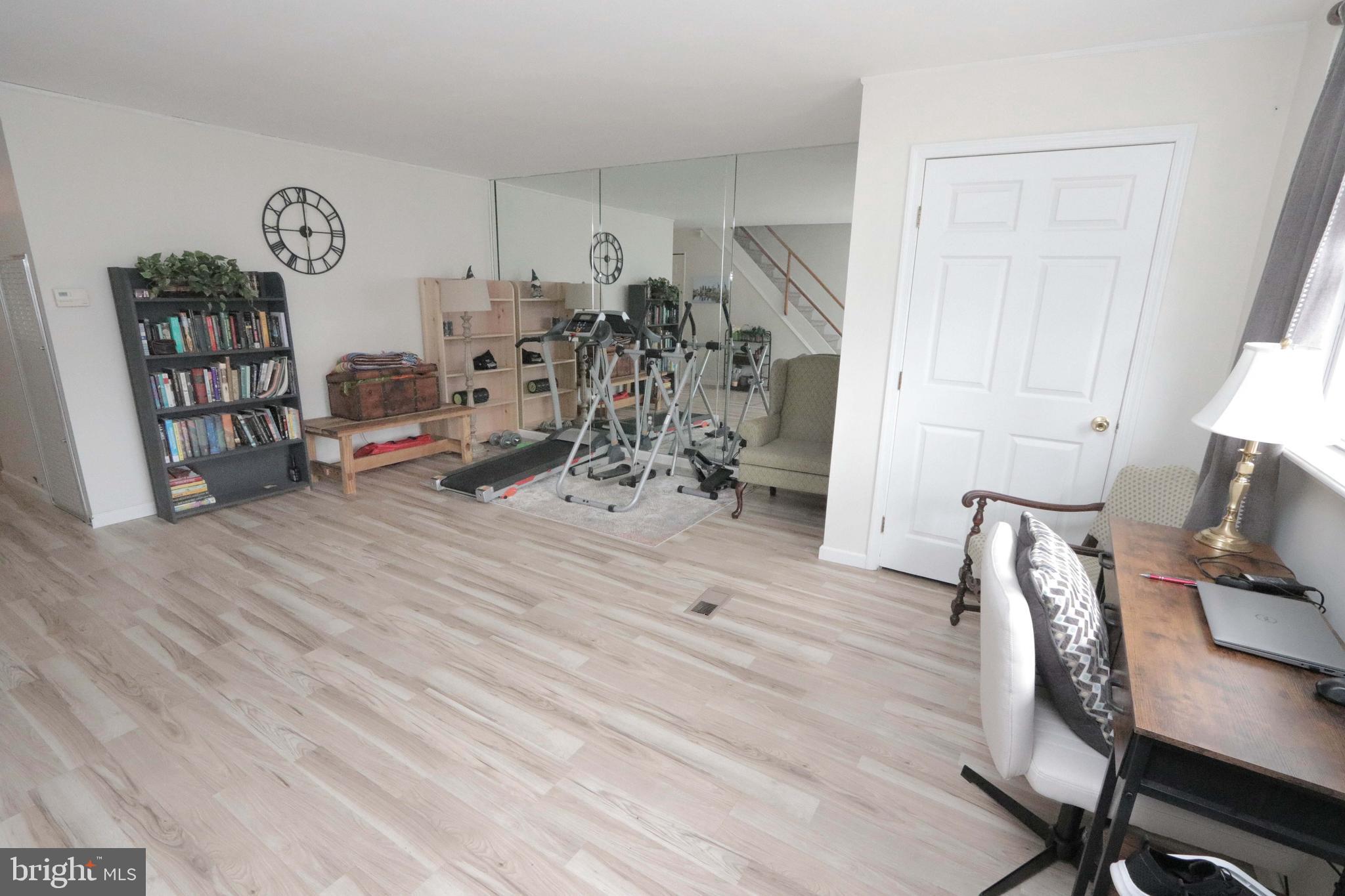 12124 Rambler Road Philadelphia, PA 19154 - Photo 5 of 26 a view of a workspace with furniture and wooden floor