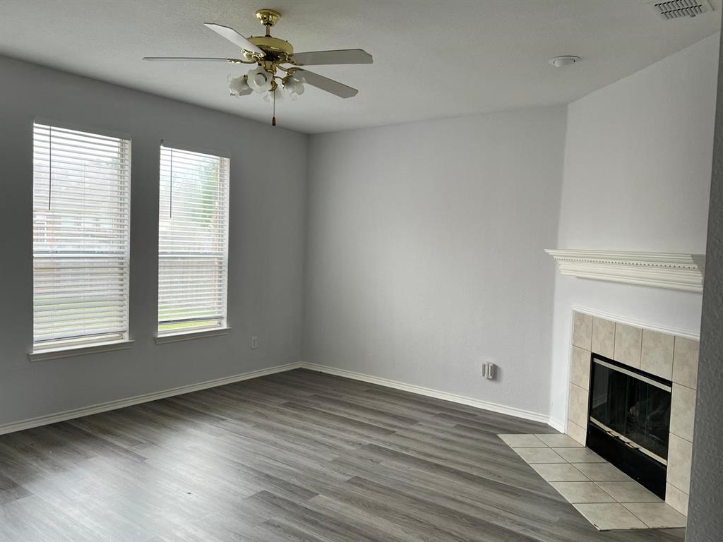 4312 Ridge Point Lane Plano, TX 75024 - Photo 11 of 16 a view of empty room with wooden floor and fan