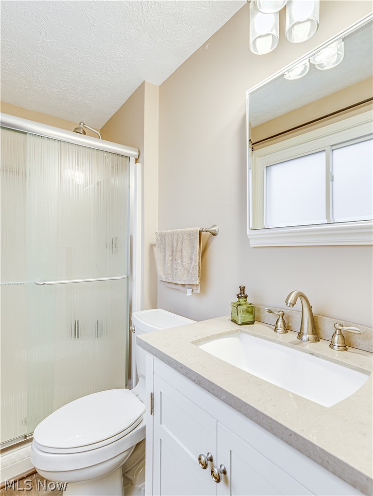 507 Everhard Road Southwest North Canton, OH 44709 - Photo 27 of 30 Master bath with shower. LTV flooring