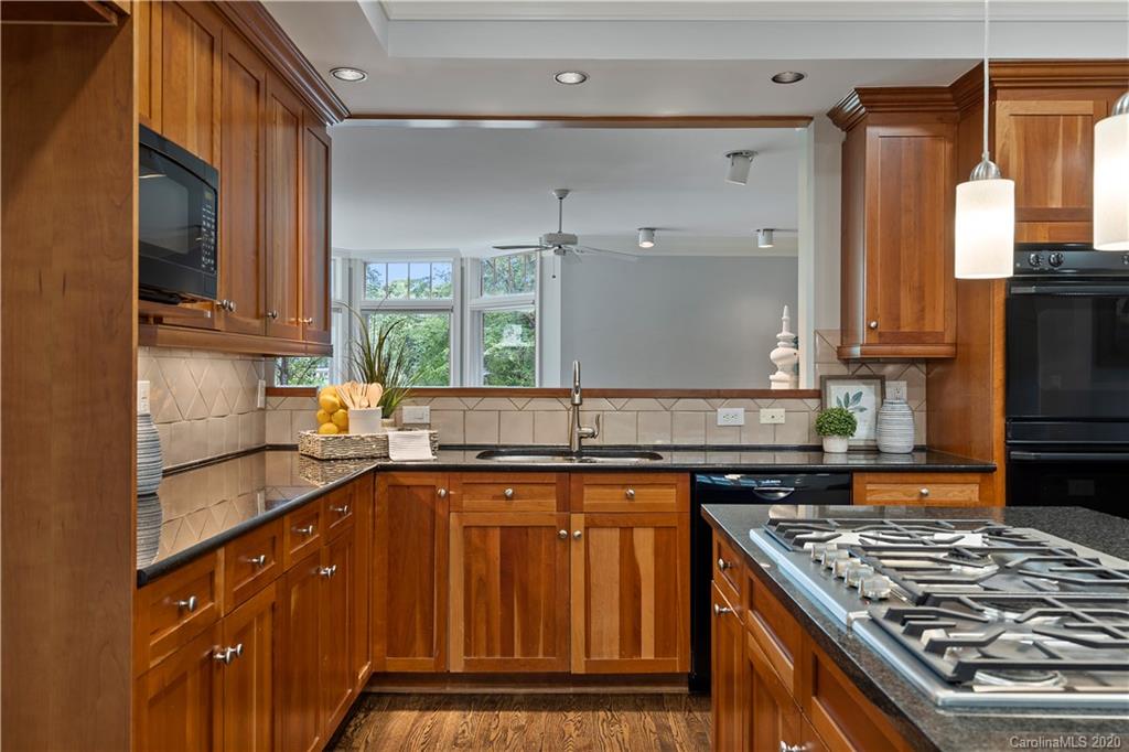 5321 Colony Road Charlotte, NC 28226 - Photo 11 of 29 a kitchen with stainless steel appliances granite countertop a sink stove and refrigerator