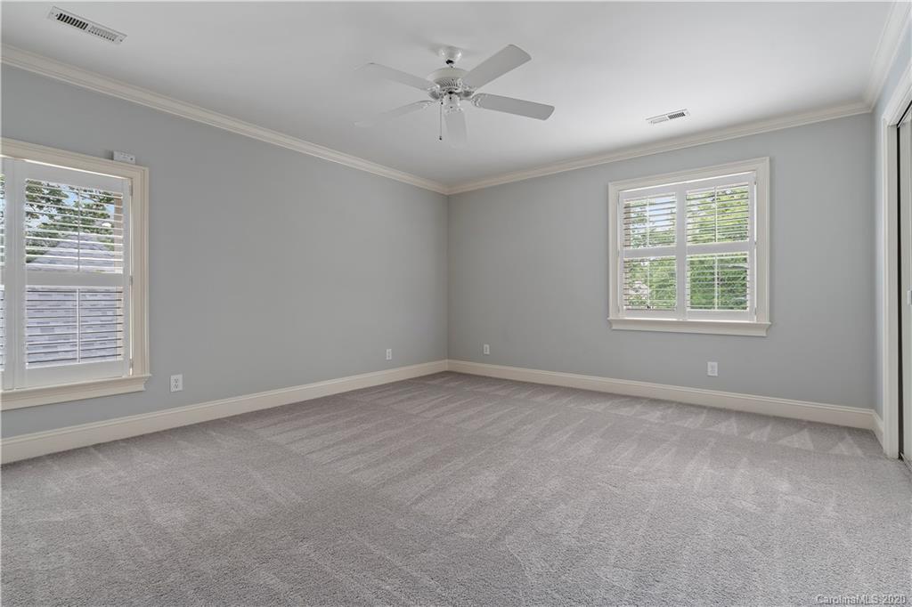 5321 Colony Road Charlotte, NC 28226 - Photo 24 of 29 an empty room with a window and a ceiling fan