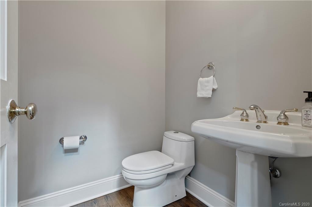5321 Colony Road Charlotte, NC 28226 - Photo 4 of 29 a bathroom with a sink mirror and toilet