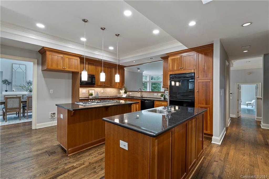5321 Colony Road Charlotte, NC 28226 - Photo 9 of 29 a kitchen with stainless steel appliances granite countertop counter top space a sink and a refrigerator
