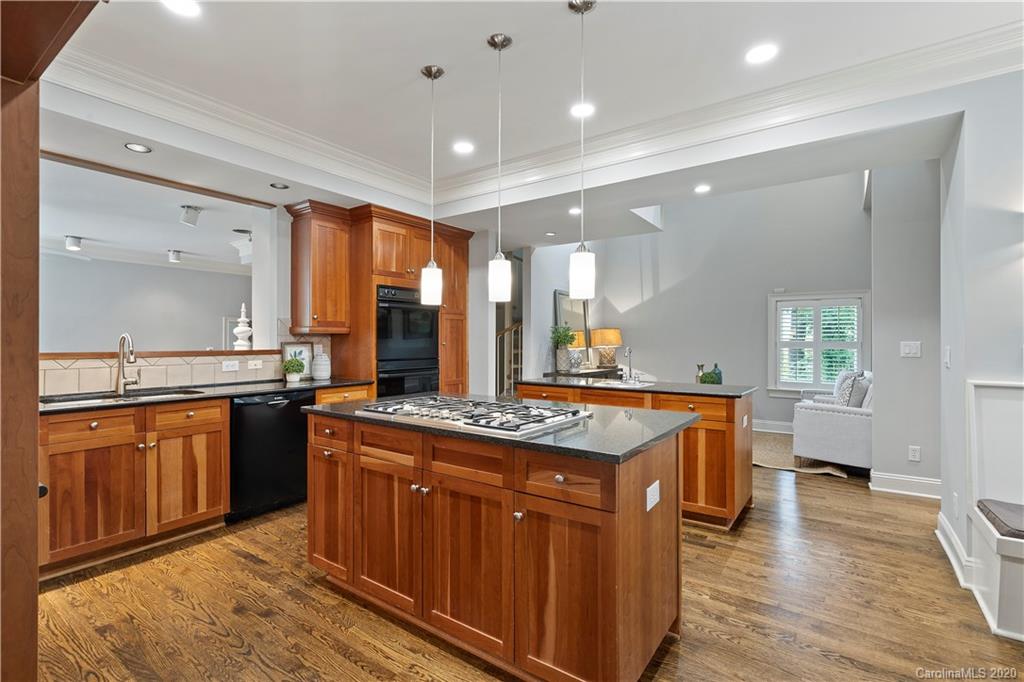 5321 Colony Road Charlotte, NC 28226 - Photo 10 of 29 a kitchen with stainless steel appliances granite countertop wooden cabinets and a granite counter tops