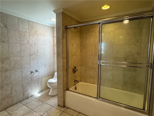 a bathroom with a shower and a toilet