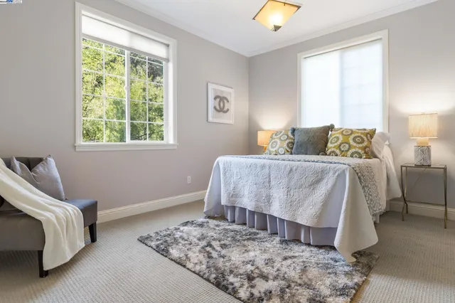 a bedroom with a bed and a couch