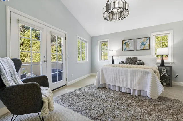 a bedroom with a bed and glass window