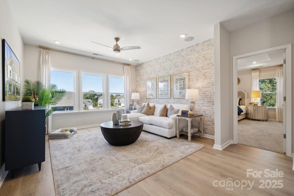 1514 Hubert Graham Way Tega Cay, SC 29708 - Photo 13 of 22 a living room with furniture and a large window