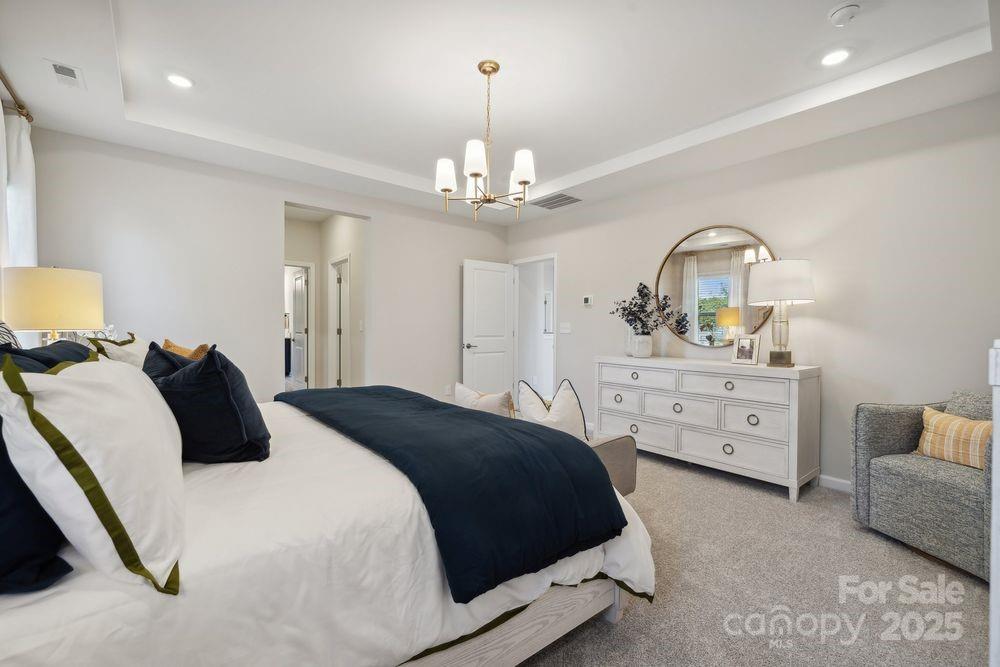 1514 Hubert Graham Way Tega Cay, SC 29708 - Photo 15 of 22 a bedroom with a bed and a dresser