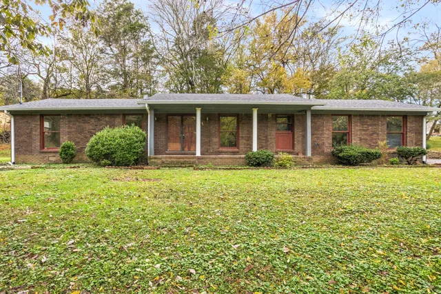 front view of a house with a yard
