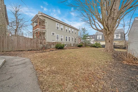 a view of a building with a yard