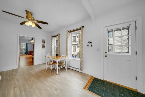 a view of a livingroom with furniture and windows