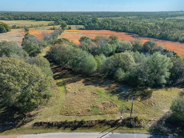a view of a lake with a yard