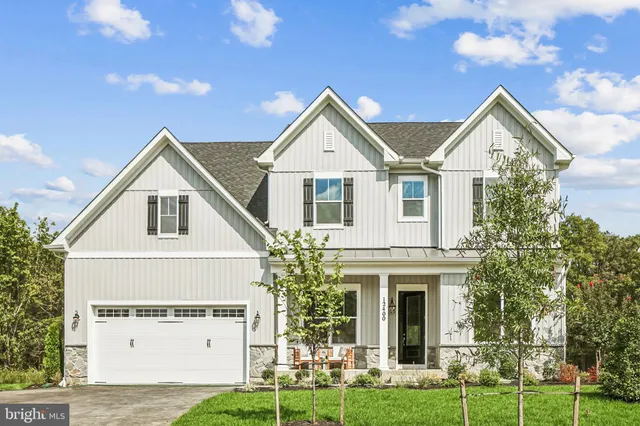 a view of house with yard and green space