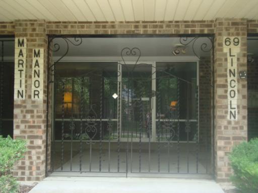 69 Lincoln Avenue, Unit 4 Riverside, IL 60546 - Photo 3 of 10 a view of a glass door with a glass door