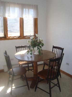 69 Lincoln Avenue, Unit 4 Riverside, IL 60546 - Photo 6 of 10 a view of a dining room with furniture and window